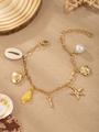 Golden ocean theme bracelet featuring white shells, starfish, and a pearl charm - Letter I(I)