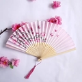 Traditional pink silk folding fan with bamboo ribs featuring cherry blossoms and tassels - Pink Cherry Blossom & Butterfly Wooden Ribs Style (Women's Fan-65)