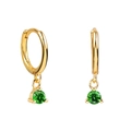 Close-up of gold huggie hoop earrings featuring round-cut green zircon drops on white base - Green