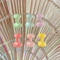 Close-up of colorful mini resin alphabet accessories with glossy finish in candy colors - Letter I