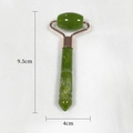 Green jade resin face roller with rose gold metal frame and dimensions 9.5cm by 4cm - Green