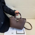 Dark brown leather bucket bag with bamboo toggle closure and pebble grain finish - Small / Brown
