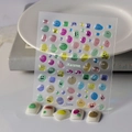 Detail of 3D macaron jelly nail stickers with cute monster eyes on white nail tips - Macaron Color Block Expression Style (CO-016)