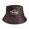 Detailed close-up of brown bucket hat featuring vintage white letter embroidery and stitching - 55-58cm / Coffee Brown (Vintage)