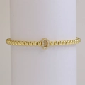 Gold beaded elastic bracelet featuring a sparkling zircon micro-pave letter D charm - Letter D