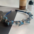 Deep blue crystal headband with glittering rhinestones on a slim steel frame - Blue Flower Crystal