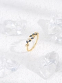Macro shot of gold leaf ring with marquise blue stones and white zircon details - Blue