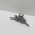 Detailed view of gunmetal spider web metal hair claw with sleek punk aesthetic design - Spiderweb Hair Claw / Gunmetal