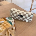 Brown corduroy checkered stationery bag on a wooden desk with elegant decor and warm lighting - Light Brown Checkerboard