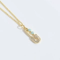 Gold safety pin necklace with blue evil eye beads and pavé white zircons on white backdrop - Safety Pin Pendant (XL3214) / Sky Blue Eye