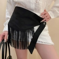 Detail of bohemian black fringe belt on a model showing tassel texture and drape - Black Bohemian Tassel Belt