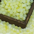 Macro shot of 10mm yellow gradient round glass beads in a rustic wooden box for jewelry DIY - 10mm / N9# Light Yellow (10MM)
