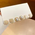 Three pairs of pearl and gold geometric stud earrings set on a white display card - Pearl Flower/Geometric (20# Silver Earring Post)