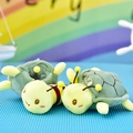 Close-up detail shot of two adorable bee turtle plush toy keychains for backpacks - Bee Turtle Style / 13cm