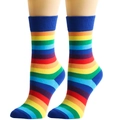 Detail of colorful rainbow striped crew socks with elastic ribbed cuffs on a model - One Size / Blue Trim