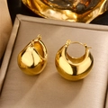 Detailed close-up of chunky U-shape gold earrings with a polished surface on a tray - Gold Chunky Drop (E-360)