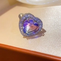 Detailed view of silver heart-shaped ring featuring a purple zircon and halo setting - Silver Base Purple Heart Style