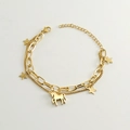 Detail of gold double-layer chain bracelet featuring star and unicorn pendants - Gold - Unicorn Bracelet