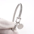 Detail of twisted cable stainless steel bracelet with St. Benedict medal and U-hook - Gen 2 #Tag / Silver