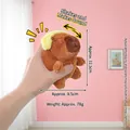 Brown Capybara plush keychain with yellow hat, soft polyester toy with sound function - Yellow-eared Strange-sounding Capybara