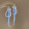 Orecchini artigianali con nappe di perline azzurre e decorazione a fiocco trasparente - Stile Nappina di Perline con Perno in Argento (76#) / Blu