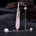 Detail of rose quartz hexagonal pendant with vintage silver cap hanging on dark wood - Silver Rose Quartz