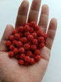 Detailed macro of 10mm red clay Shamballa beads held by hand for size reference - 10mm / Bright Red (19)