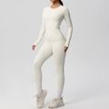 Detail view of off-white yoga set showing high-elasticity fabric and side pocket design - S / Top And Bottom / Light Ivory