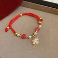 Close-up of woven red cord bracelet featuring a gold bead and rocking horse charm - Gold Red Pink Rocking Horse Style (6# Bracelet)