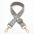 Close-up of wide canvas shoulder strap with embroidered grey rhombus geometric pattern - Grey-Beige