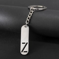 Polished stainless steel keychain featuring a hollowed-out letter Z pendant charm - Letter Z
