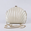 Chic shell-shaped ivory acrylic evening clutch bag with gold snake chain and glossy finish - Beige