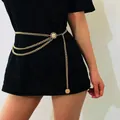 Close-up of golden multi-layer body chain with vintage coins on black clothing - Gold Lady Portrait Multi-Layer Waist Chain