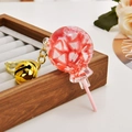 Lollipop keychain with strawberry slices inside and a golden bell accessory - Fruit Lollipop [Strawberry Pink]