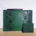 Detail of dark green snakeskin textured A4 envelope clutch and matching card holder - Dark Green
