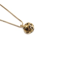 Minimalist gold necklace featuring a spherical pendant with black crescent enamel pattern - Black Crescent