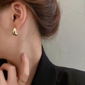 Close-up of minimalist golden C-shaped bean earrings and matching ring on a model - Streamlined C-Shape Bean (12# Silver Earring Post-Gold)