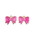 Close-up of pink enamel bow charms with gold metal frames and hanging loops - Rose Red