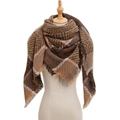 Plaid knitted scarf in brown and khaki with fringe detail on a mannequin - 135x135cm / Coffee