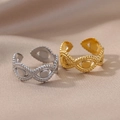 Macro detail of gold and silver evil eye rings with beaded edges on silk fabric - Evil Eye Beaded Edge
