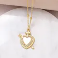 Golden heart necklace with cross detail and white inlay surrounded by sparkling zircons - C-Heart with Arrow/Cross/Zirconia