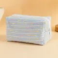 Light blue floral quilted toiletry bag with pastel stripes and white zipper closure - Light Blue with Colorful Lines