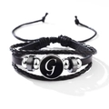 Classic black leather bracelet with silver metal beads and white letter G charm detail - Letter-G