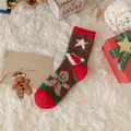 Detail of plush Christmas stockings with gingerbread man patterns on white faux fur - Striped Stars