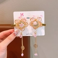 Pink floral hair clips with golden tassels and leaf pendants on white card display - Lotus Style 1 Pink White