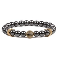 Detailed macro of hematite stone bead bracelet with gold crown and zircon accents - Gold Drill Ball