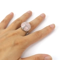 Macro shot of handmade wire wrapped tree of life ring with round pink quartz stone - Rose Quartz