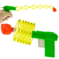Green retractable spring fist gun toy with yellow arm and orange fist for kids - Large Fist Gun Toy