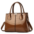 Caramel brown crocodile embossed patent leather handbag with detachable shoulder strap - Earthy Yellow