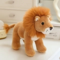 Lifelike plush lion toy in standing pose with fluffy orange mane and soft brown fur - Lion